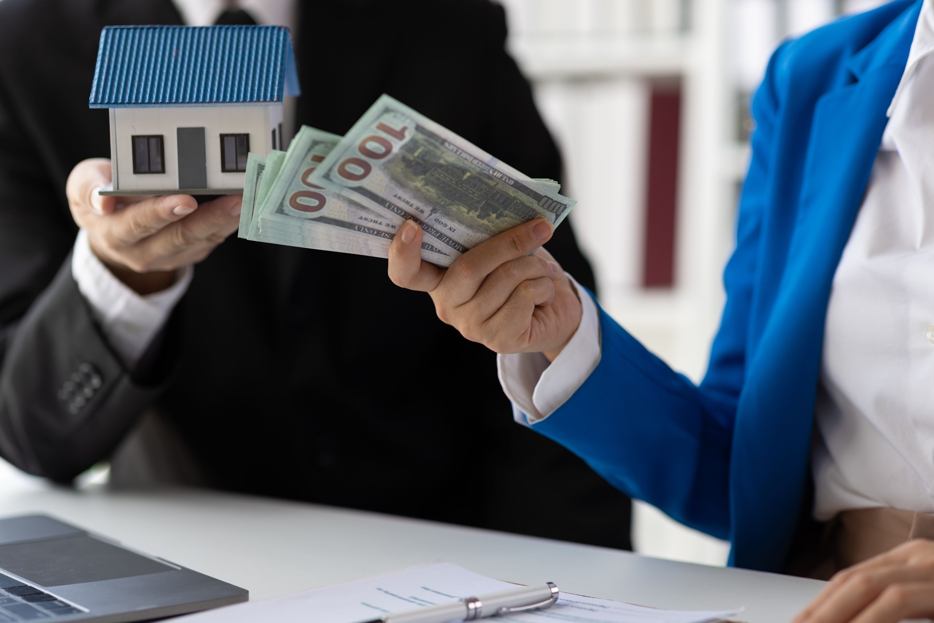 Businesswoman, real estate agents discuss offer house sale prices, fee, mortgage, interest, rent, cash flow, loan. House and land trading ideas.